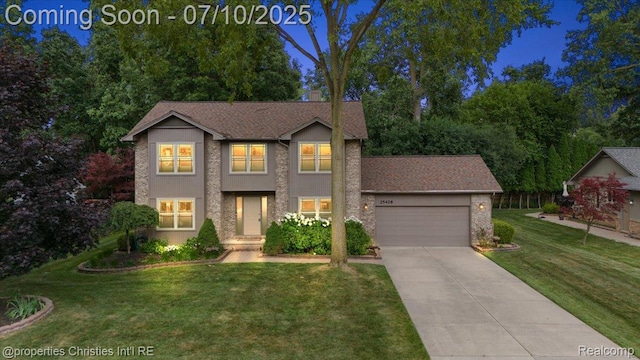 25426 Lindenwood Ln, Southfield, MI 48033 - traditional-style house with a garage, driveway, and a front yard
