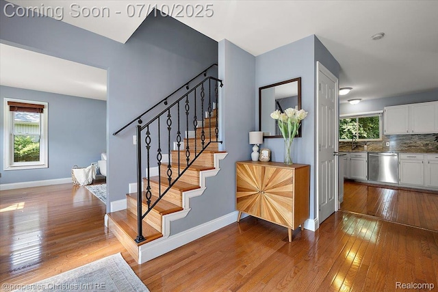 25426 Lindenwood Ln, Southfield, MI 48033 - stairway featuring hardwood / wood-style floors and baseboards