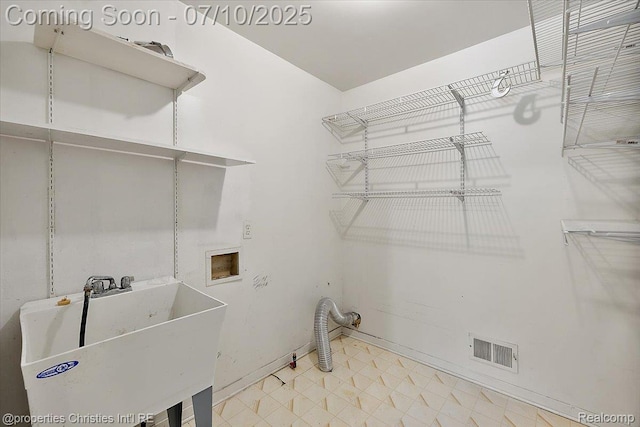 25426 Lindenwood Ln, Southfield, MI 48033 - washroom with washer hookup and tile patterned floors