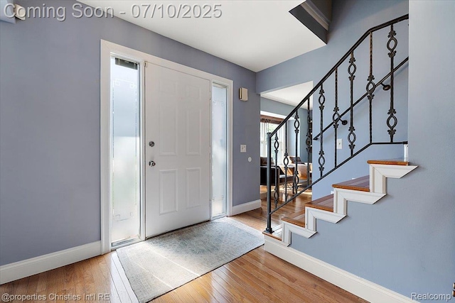 25426 Lindenwood Ln, Southfield, MI 48033 - foyer featuring wood finished floors and stairway