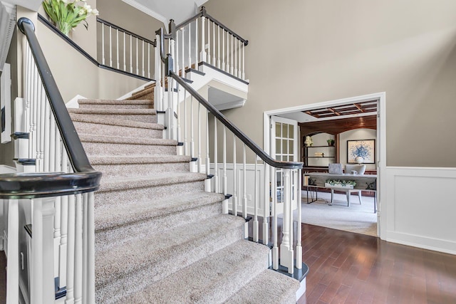 3800 Guest Rd, Jackson, MI 49203 - stairway featuring hardwood / wood-style flooring and wainscoting