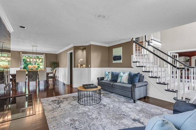 3800 Guest Rd, Jackson, MI 49203 - living room featuring crown molding, wood finished floors, wainscoting, and stairs