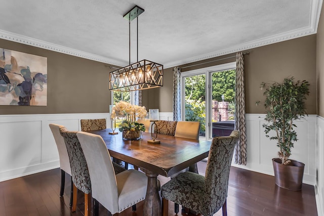 3800 Guest Rd, Jackson, MI 49203 - dining room featuring a textured ceiling, a wainscoted wall, hardwood / wood-style flooring, crown molding, and a chandelier