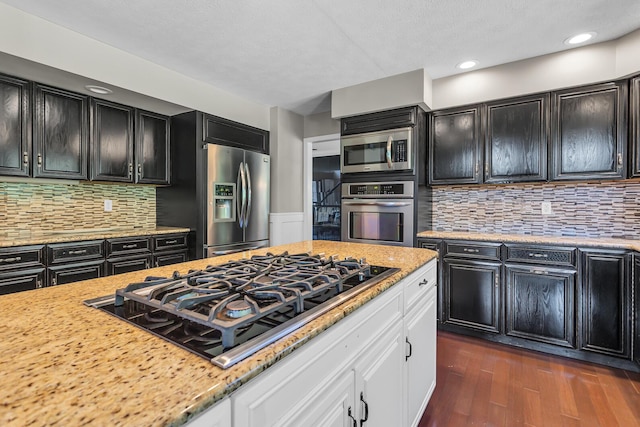 3800 Guest Rd, Jackson, MI 49203 - kitchen featuring stainless steel appliances, dark cabinetry, white cabinetry, and recessed lighting