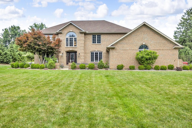 3800 Guest Rd, Jackson, MI 49203 - view of front of property featuring brick siding and a front lawn