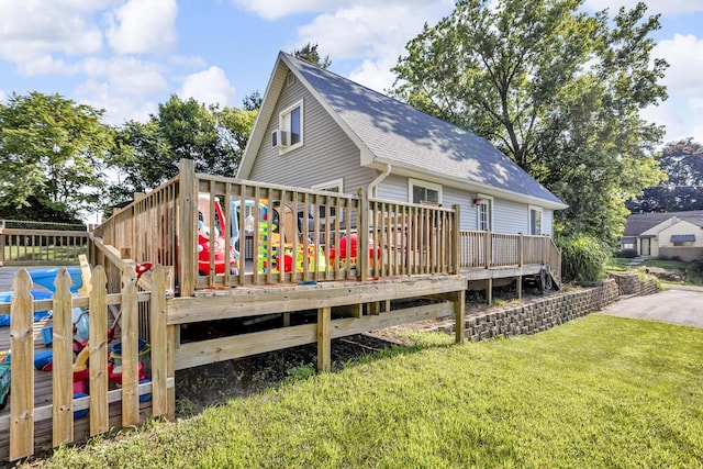 226 Briscoe Pl, Jackson, MI 49203 - rear view of property with a wooden deck, a lawn, and roof with shingles