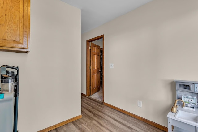 226 Briscoe Pl, Jackson, MI 49203 - kitchen with light wood-type flooring and baseboards
