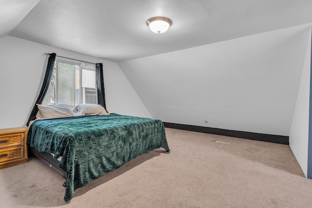 226 Briscoe Pl, Jackson, MI 49203 - bedroom with vaulted ceiling, carpet, and cooling unit
