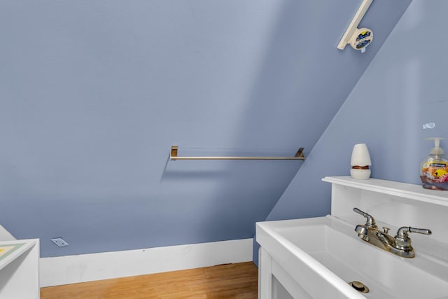 226 Briscoe Pl, Jackson, MI 49203 - bathroom featuring a sink and wood finished floors