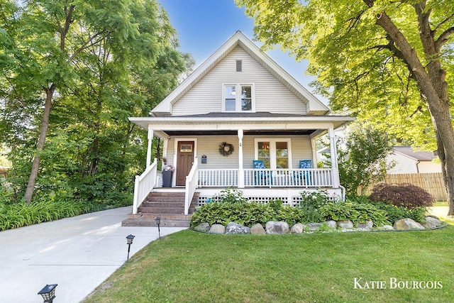 140 S Monroe St NE, Rockford, MI 49341 - view of front of property featuring covered porch