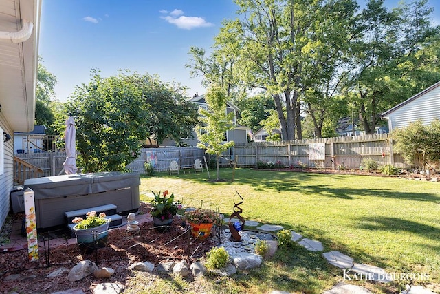 140 S Monroe St NE, Rockford, MI 49341 - fenced backyard featuring a hot tub