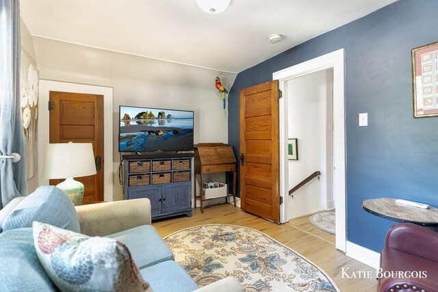 140 S Monroe St NE, Rockford, MI 49341 - living room with light wood-style floors and baseboards