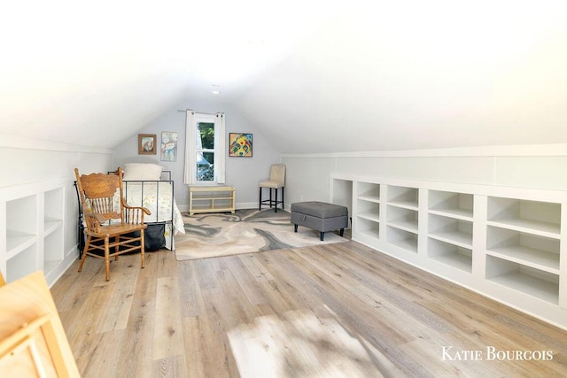 140 S Monroe St NE, Rockford, MI 49341 - sitting room featuring lofted ceiling and wood finished floors