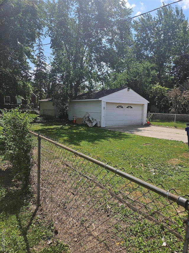15900 Murray Hill St, Detroit, MI 48227 - view of yard featuring an outbuilding and a garage