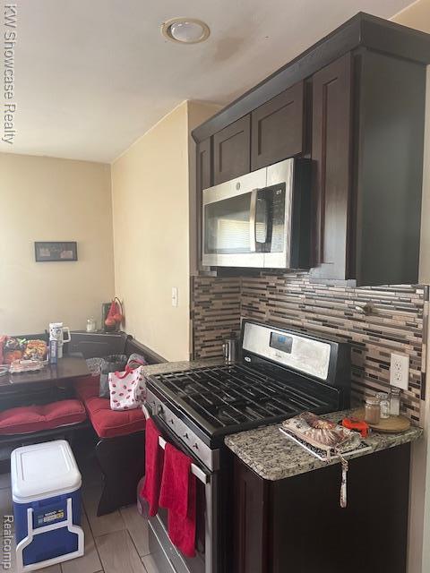 9624 Winston, Redford, MI 48239 - kitchen featuring appliances with stainless steel finishes, tasteful backsplash, and stone counters