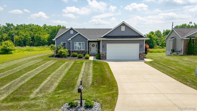 5606 Chatham Ln, Grand Blanc, MI 48439 - craftsman-style home featuring a garage, a front yard, concrete driveway, stone siding, and a shingled roof