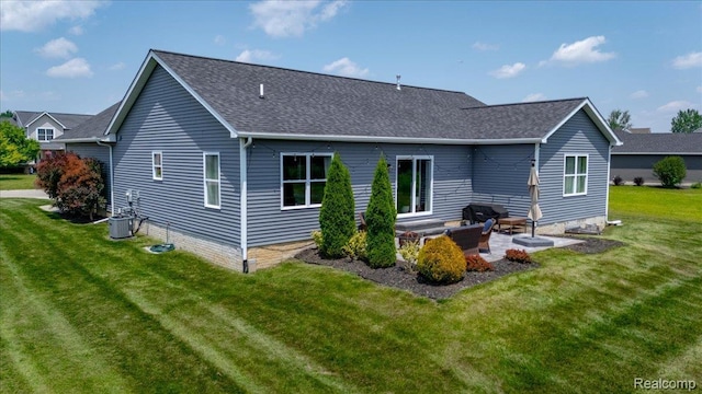 5606 Chatham Ln, Grand Blanc, MI 48439 - back of property featuring a yard, a patio area, and roof with shingles