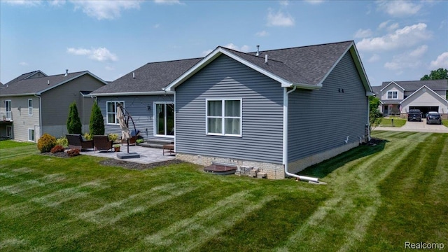 5606 Chatham Ln, Grand Blanc, MI 48439 - rear view of property with a patio, entry steps, a yard, and a shingled roof