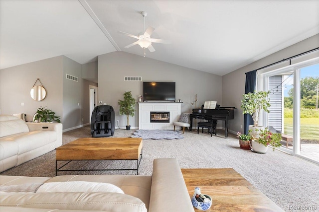 5606 Chatham Ln, Grand Blanc, MI 48439 - carpeted living area featuring a ceiling fan, lofted ceiling, and a glass covered fireplace