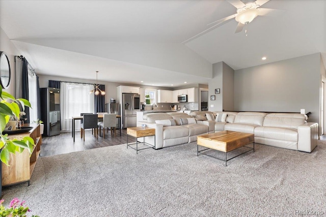 5606 Chatham Ln, Grand Blanc, MI 48439 - living area featuring ceiling fan, a chandelier, wood finished floors, recessed lighting, and high vaulted ceiling