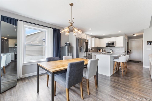 5606 Chatham Ln, Grand Blanc, MI 48439 - dining space featuring wood finished floors, a chandelier, and recessed lighting