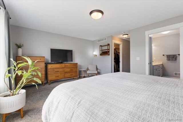 5606 Chatham Ln, Grand Blanc, MI 48439 - bedroom with carpet, a spacious closet, and connected bathroom