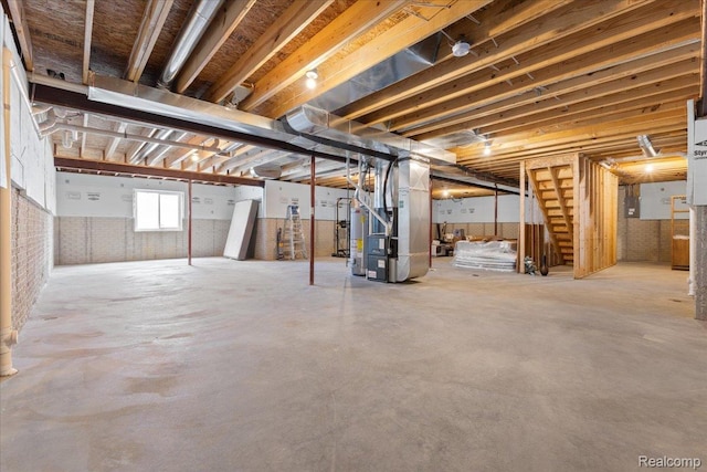 5606 Chatham Ln, Grand Blanc, MI 48439 - basement featuring heating unit, water heater, and stairs