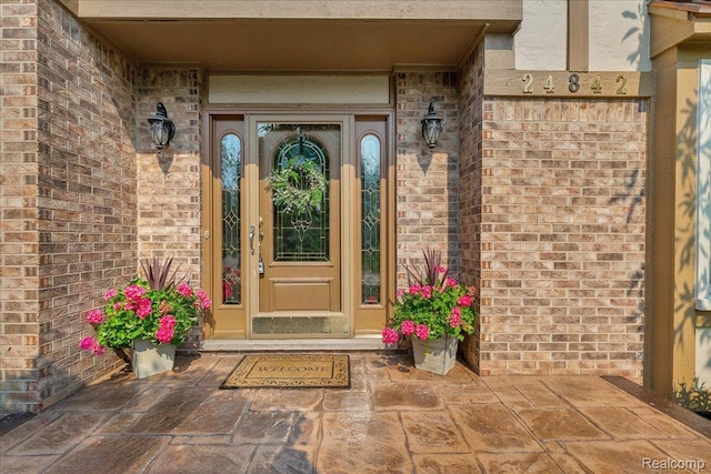24842 White Plains Dr, Novi, MI 48374 - doorway to property featuring brick siding
