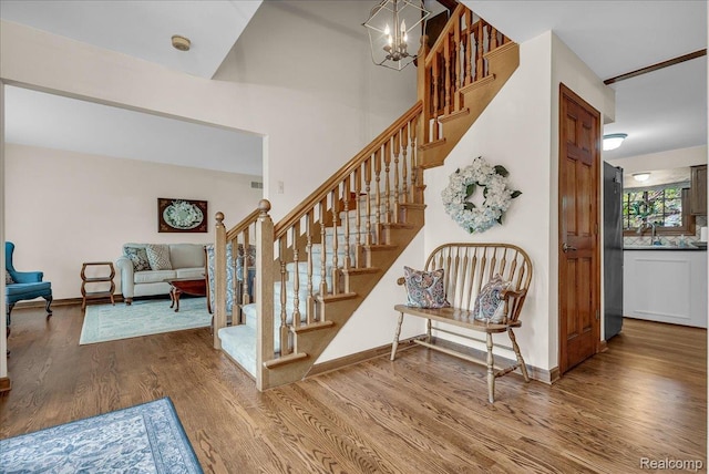24842 White Plains Dr, Novi, MI 48374 - stairs with wood finished floors and a chandelier
