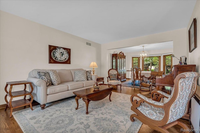 24842 White Plains Dr, Novi, MI 48374 - living area with a chandelier and wood finished floors