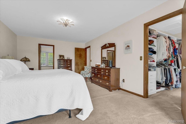 24842 White Plains Dr, Novi, MI 48374 - bedroom featuring light colored carpet and a walk in closet