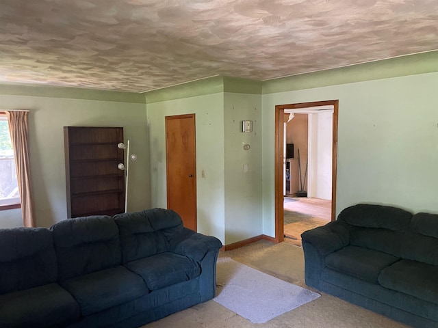 4120 S Washington Rd, Saginaw, MI 48601 - carpeted living room with a textured ceiling and baseboards