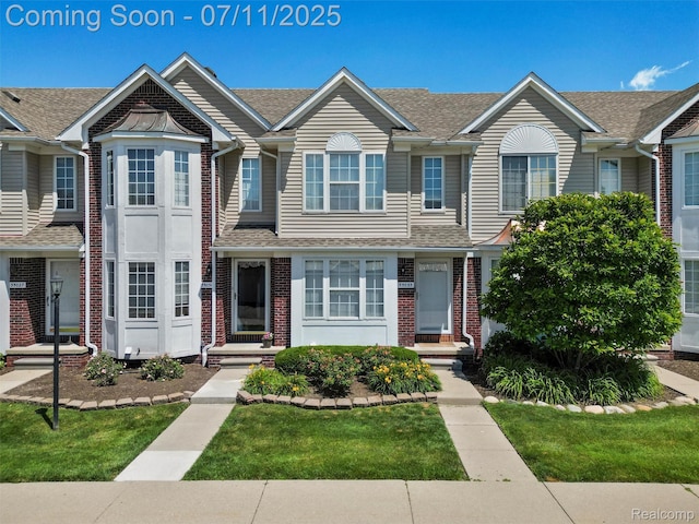 35033 Windsor Dr, New Baltimore, MI 48047 - townhome / multi-family property with brick siding and roof with shingles