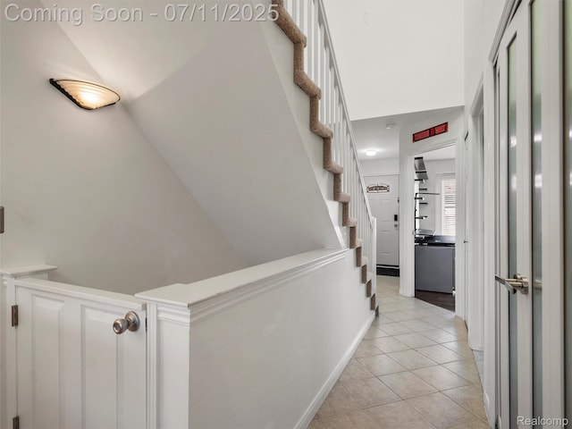 35033 Windsor Dr, New Baltimore, MI 48047 - corridor featuring light tile patterned flooring and stairway