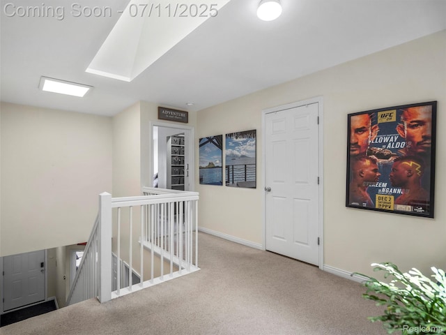35033 Windsor Dr, New Baltimore, MI 48047 - hall featuring carpet floors, an upstairs landing, and a skylight