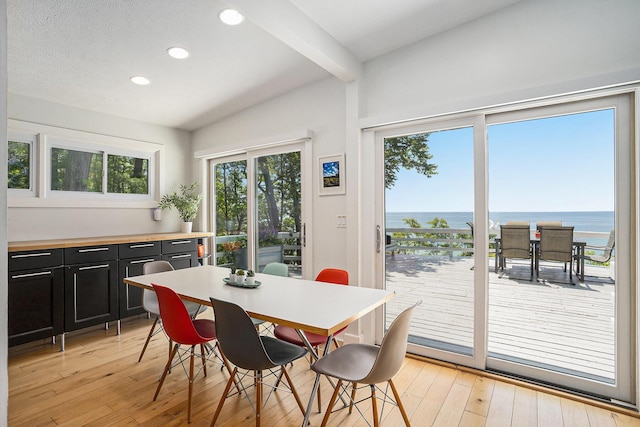 6881 Helena St, West Olive, MI 49460 - dining room with light wood-type flooring, recessed lighting, and a water view