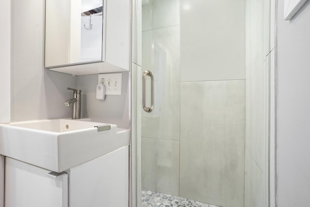 6881 Helena St, West Olive, MI 49460 - bathroom with a stall shower and vanity