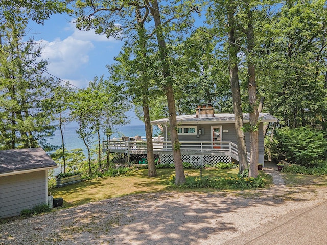 6881 Helena St, West Olive, MI 49460 - view of front facade featuring a chimney and a deck