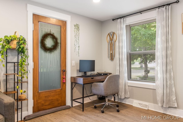 3255 Prairie St SW, Grandville, MI 49418 - office area featuring wood finished floors and plenty of natural light