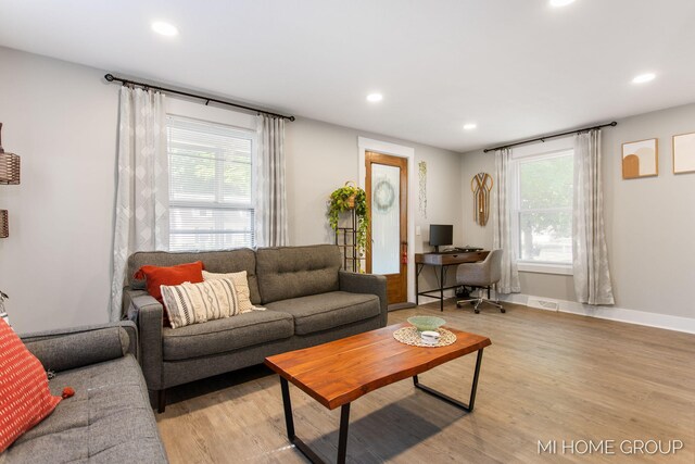 3255 Prairie St SW, Grandville, MI 49418 - living area featuring light wood-type flooring, recessed lighting, and an office area