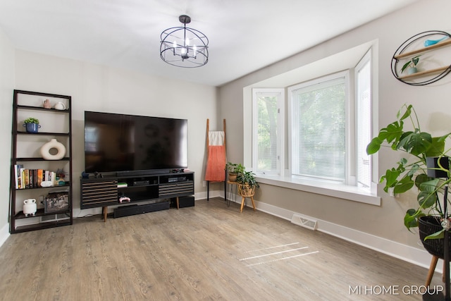 3255 Prairie St SW, Grandville, MI 49418 - living area with a chandelier and wood finished floors