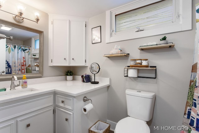 3255 Prairie St SW, Grandville, MI 49418 - bathroom featuring vanity and toilet