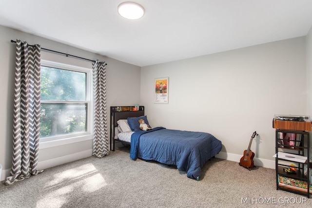 3255 Prairie St SW, Grandville, MI 49418 - carpeted bedroom featuring baseboards