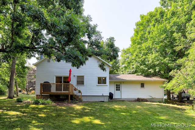 3255 Prairie St SW, Grandville, MI 49418 - back of property with a lawn and a deck