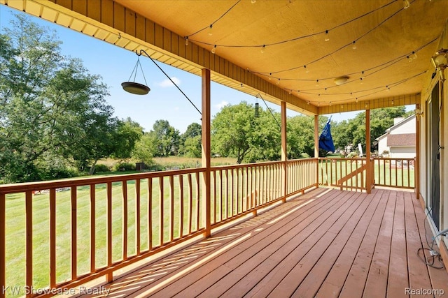 5037 Scheuners Way, Howell, MI 48843 - deck featuring a yard and view of wooded area