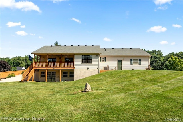 5037 Scheuners Way, Howell, MI 48843 - rear view of house featuring stairs, a deck, and a yard