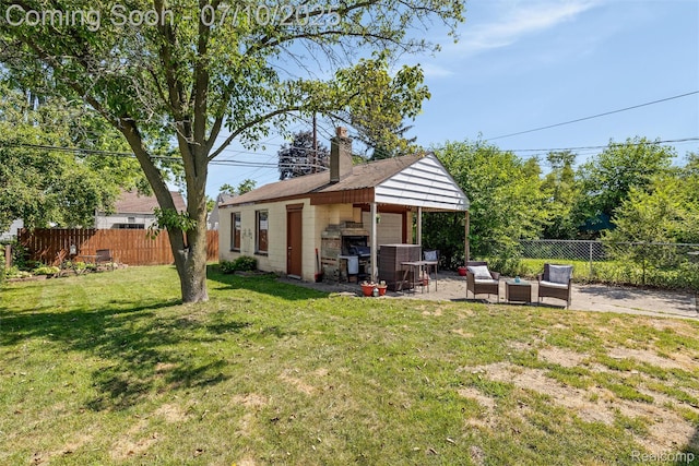 8600 Saratoga St, Oak Park, MI 48237 - back of property featuring an outdoor hangout area, a fenced backyard, a chimney, and a patio