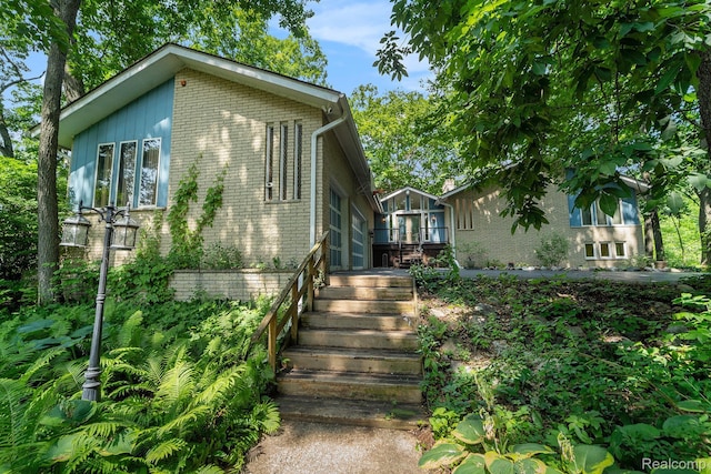 4729 Curtis Ln, Clarkston, MI 48346 - mid-century inspired home with brick siding and stairs