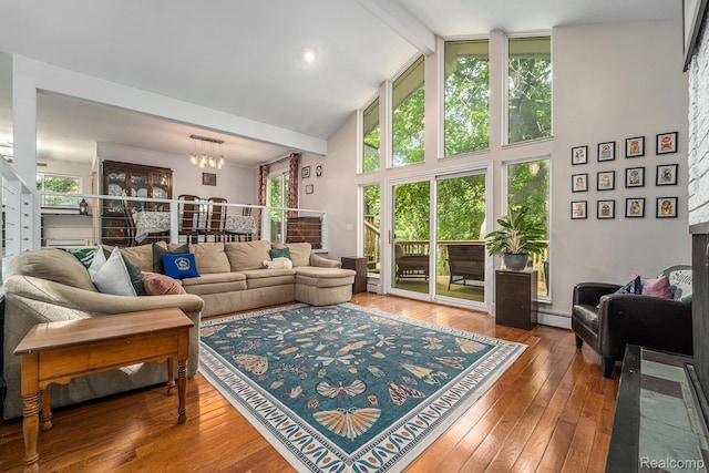 4729 Curtis Ln, Clarkston, MI 48346 - living room featuring high vaulted ceiling, beamed ceiling, baseboard heating, hardwood / wood-style flooring, and healthy amount of natural light