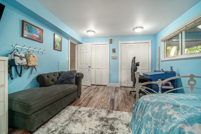 4729 Curtis Ln, Clarkston, MI 48346 - bedroom featuring multiple closets and wood finished floors